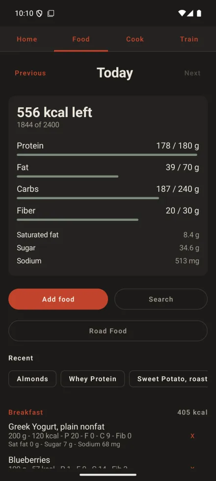 The LIFT Android food log for a day, with the day's calories and macros above it and the entries grouped under Breakfast, Lunch, Dinner and Snack, each with its weight, calories, macros and saturated fat, sugar and sodium